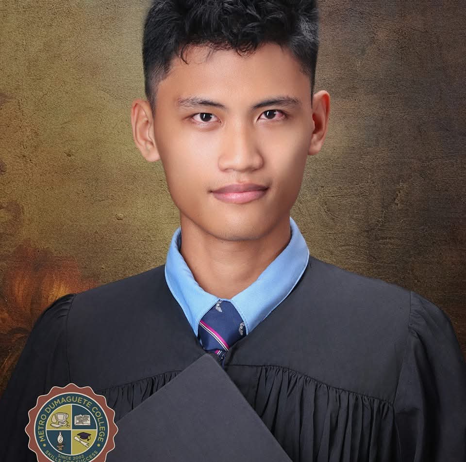 Portrait of Sharif Darjen Kyle E. Abdulhamid, web developer, smiling and looking at the camera